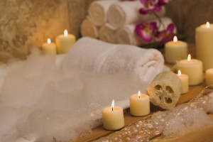 Apartments for rent in Spring TX A serene bath tub experience enhanced by the gentle glow of candles and the refreshing scent of flowers.