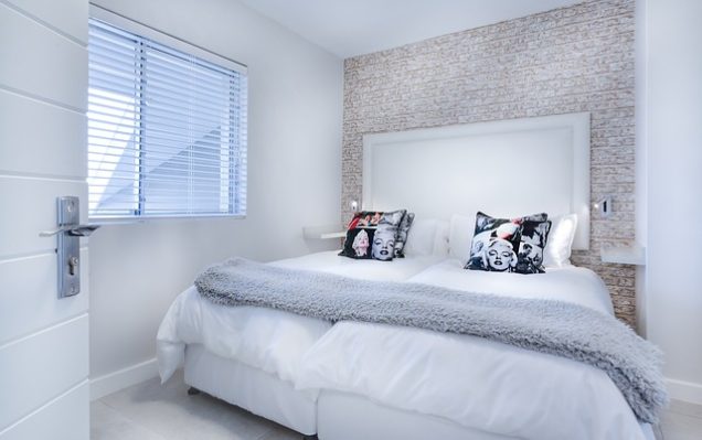 Apartments for rent in Spring TX A white bedroom with a white bed and white pillows. Perfect for those looking for Apartments in Spring TX or Apartments for rent in Spring TX.