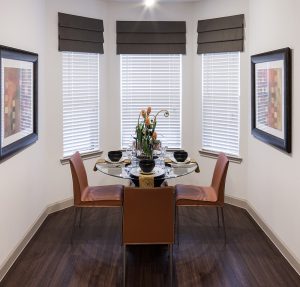 Apartments for rent in Spring TX An elegant dining room with a spacious table and comfortable chairs.