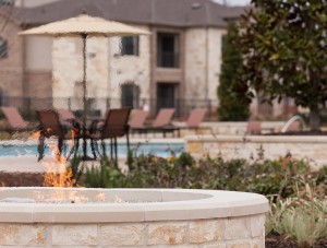 Apartment rentals in Tomball, TX - Outdoor Fire Pit with View to Pool and Patio