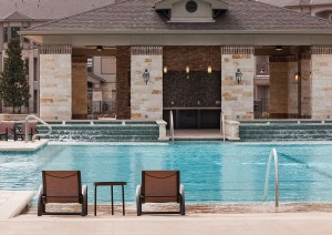 Apartment rentals in Tomball, TX - Pool with Waterfalls and Patio Area    